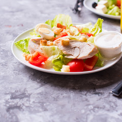 Salad with grilled chicken, vegetable and eggs.