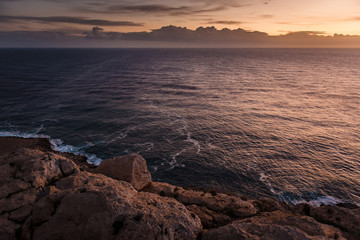 Landscape sea in Cyprus. View of the coast, calm sea and sky with a large cloud along the horizon