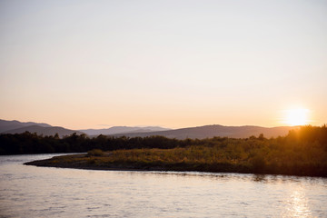 Evening beach at Cape Greco. Sea, mountains and trees at sunset. Cyprus