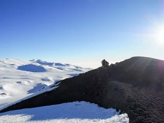 Papier Peint photo autocollant Kilimandjaro hikers on the ridge ascend mount kilimanjaro the tallest peak in africa.