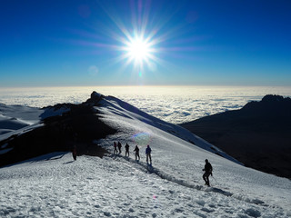 hikers on the ridge ascend mount kilimanjaro the tallest peak in africa.