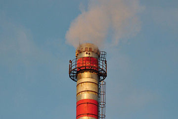 Smoking pipe in the background of the morning sky