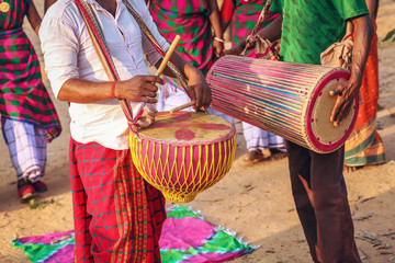 Tribal men playing local musical instruments at a folk dance at Bolpur, Shantiniketan, West Bengal