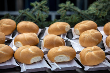 freshly baked rolls on paper trays ready to eat