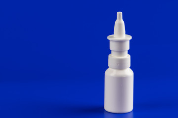Bottle of nasal spray on the table.