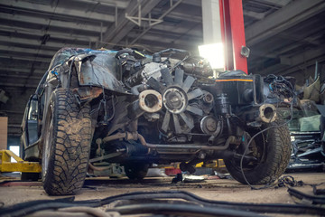 Semi-disassembled car after an accident close-up on the auto Assembly. Concept of car service, auto Assembly, used auto parts