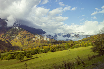 Obraz premium Mountain slopes covered with forests and low thunderclouds in Svaneti in the mountainous part of Georgia