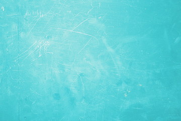 The blue background of the scratched metal plate is beautiful.