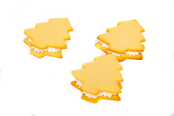 Baking cookies Christmas tree sandwich on a white plate with cream
