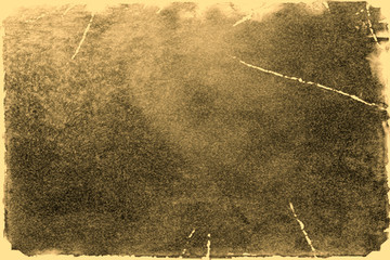 Fototapeta premium Old photo texture with stains and scratches. Vintage and antique art concept. Front view of blank old aged dirty frame with stains isolated on a white background. Detailed closeup studio shot.