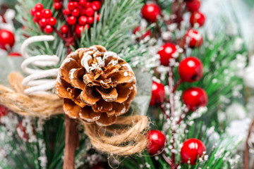 Christmas tree branch with red berries macro