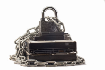Hard disk, chain and padlock on a white background. The lock is locked.