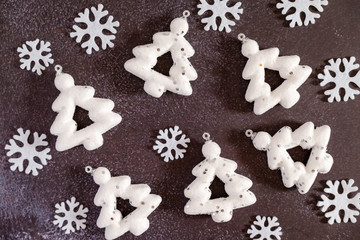Christmas trees white toys with snowflakes on a dark background