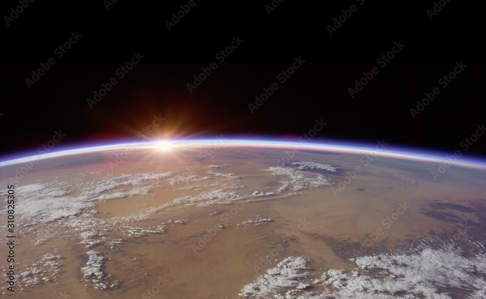 Wall mural observation of sunrise over the earth. view of planet earth from space.elements of this image furnis