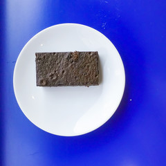 Delicious dark chocolate fudge on white plate