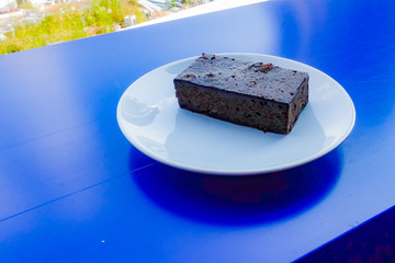 Delicious dark chocolate fudge on white plate