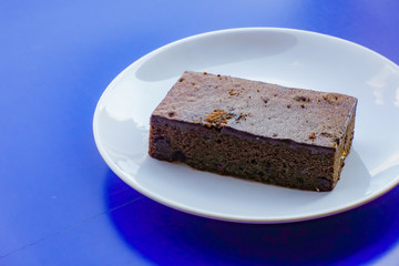 Fototapeta na wymiar Delicious dark chocolate fudge on white plate