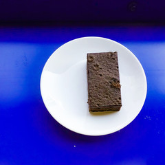 Delicious dark chocolate fudge on white plate