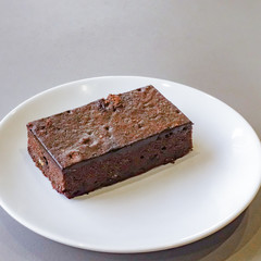 Delicious dark chocolate fudge on white plate