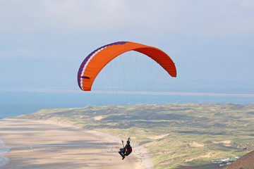 Paraglider flying above Rhossili	