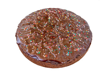 Chocolate cake with icing and decorative powder on a white background