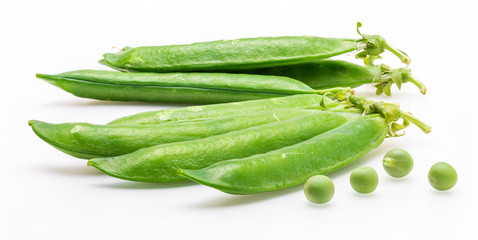 Green, tender, fresh and raw peas. Isolated on white background.