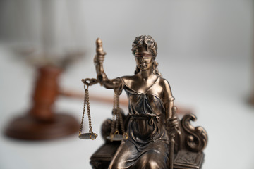 Law symbol composition. Gavel of the judge, Themis statue and scale of justice on off-white background.