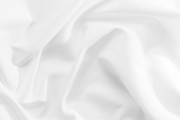 Fototapeta premium Abstract white fabric texture background. Cloth soft wave. Creases of satin, silk, and cotton.