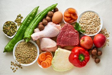Various products for healthy balanced diet on a light background