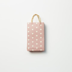 Pink paper shopping bag on white background