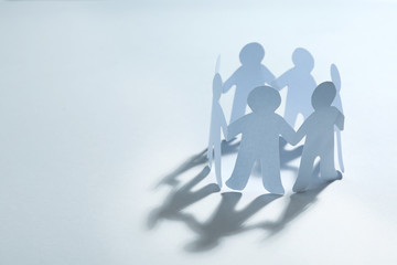 Paper people chain making circle on white background, space for text. Unity concept