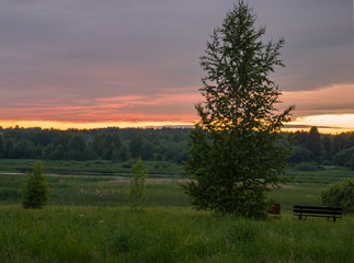 Summer colorful landscape - sunset and river