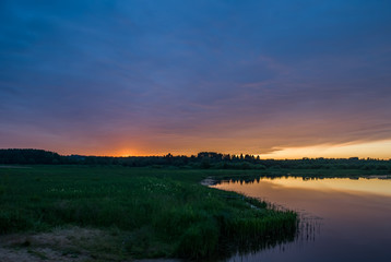 Fototapeta na wymiar Summer colorful landscape - sunset and river