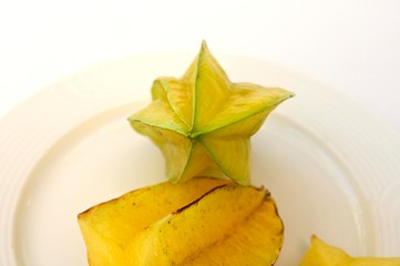 Naklejka premium unusual carambola fruit in the shape of a six ray star and five rays