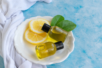 Bottles with essential lemon oil. Healthy natural beauty treatment