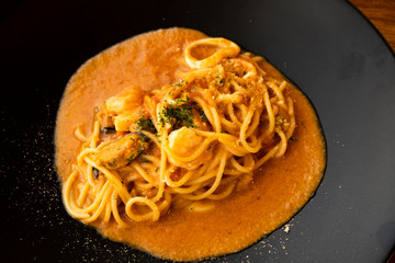 Spaghetti Seafood Sauce on a Black Plate