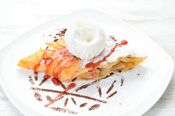 Apple strudel with ice cream. Top view. Free space for your text.