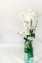 white flower on white table