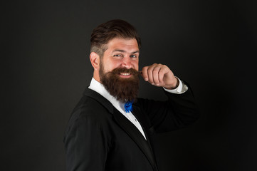 Fashion trends for groom. Groom bearded hipster man wear tuxedo and bow tie. Wedding day. Fashion collection. Long beard and mustache. Barbershop concept. Stylist fashion expert. Suit style