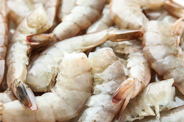 Fresh raw shrimps as background, closeup view