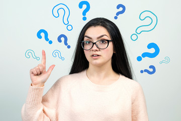 Image of excited young lady with glasses. Looking camera have an idea. Stands on a white background.	