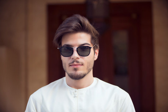 Handsome Arab Young Man Wearing Kandura And Sunglasses