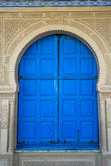 Fototapeta na wymiar Closeup view of old blue vintage door. Vertical color photography.