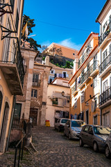 Fototapeta na wymiar Charming narrow streets in Alfama district, Lisbon, Portugal