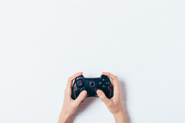 Woman's hands holding wireless joypad © progressman