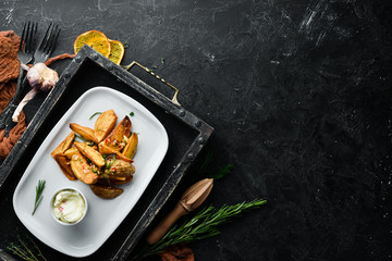 Baked potatoes with garlic and sauce. Dishes, food. Top view. Free space for your text.