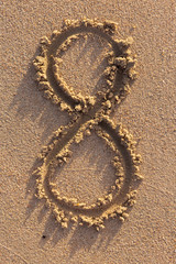 Number one written on a sandy beach. Handwritten characters collection.