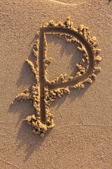 Alphabet (p) letters handwritten in sand on beach