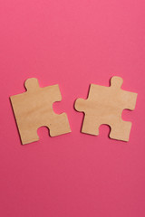 Man hand assembling puzzles on lime background