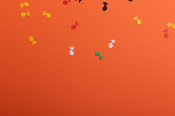 Paper colorful music notes background. View above